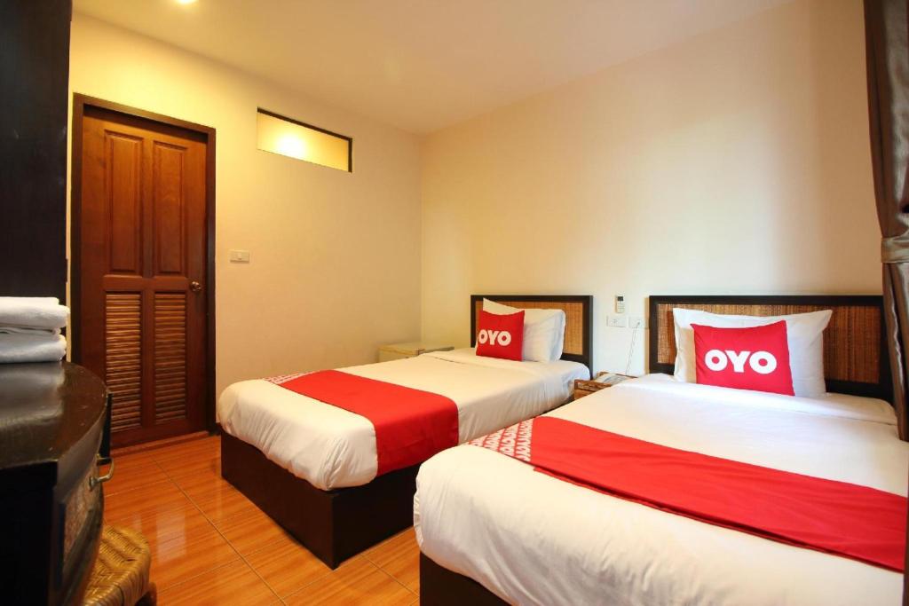 Postel nebo postele na pokoji v ubytování Pannee Lodge Khaosan - SHA Plus