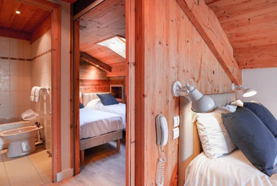 Postel nebo postele na pokoji v ubytování Chalet Hôtel des 2 Gares & SPA