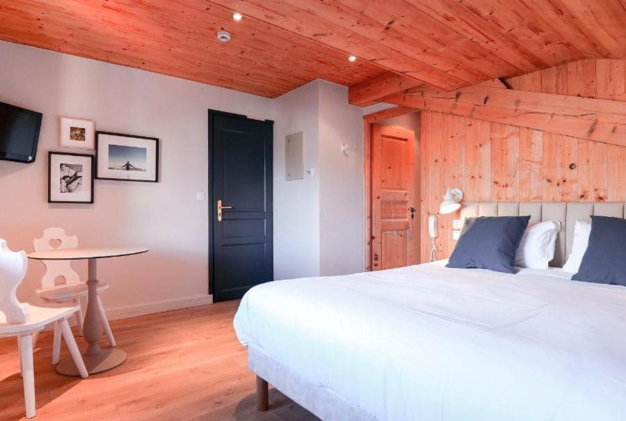 Postel nebo postele na pokoji v ubytování Chalet Hôtel des 2 Gares & SPA