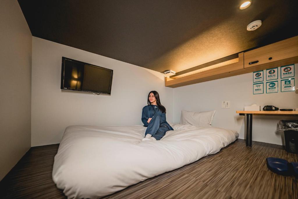 Postel nebo postele na pokoji v ubytování hotel atarayo osaka