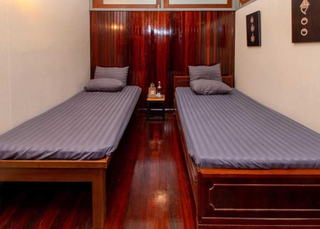 Postel nebo postele na pokoji v ubytování OYO 75469 Baan Kong Hostel