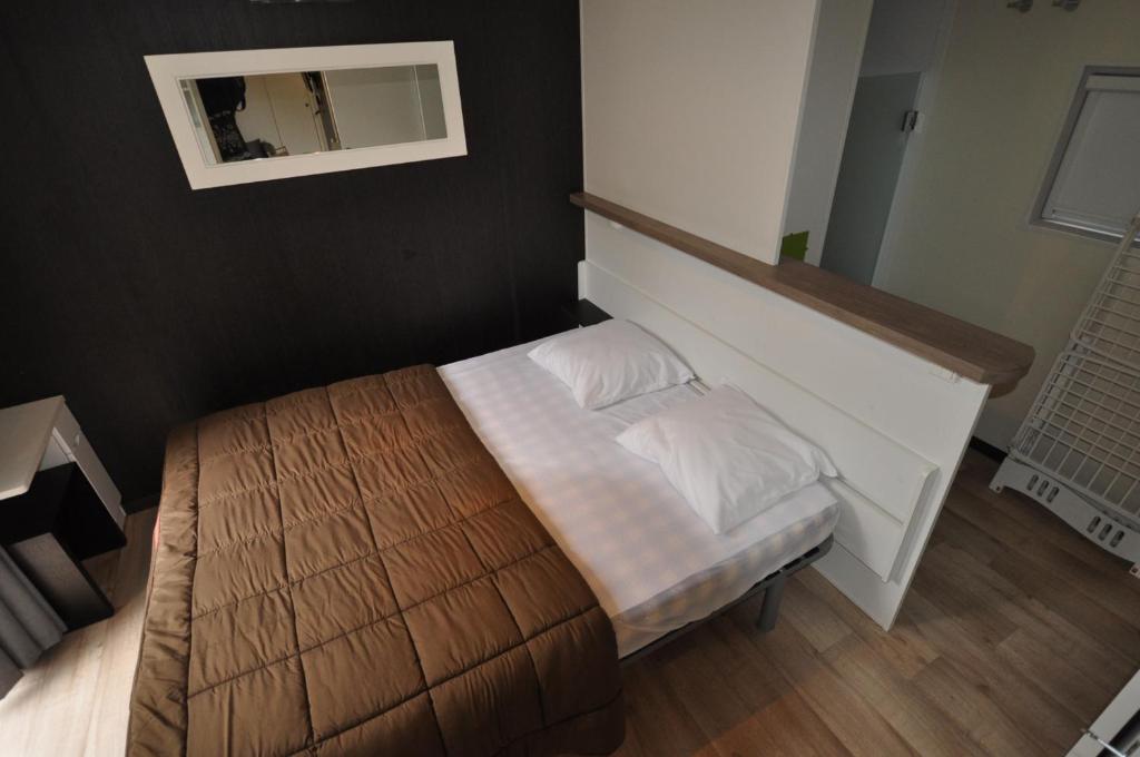 Postel nebo postele na pokoji v ubytování Camping Les Sables d'Or