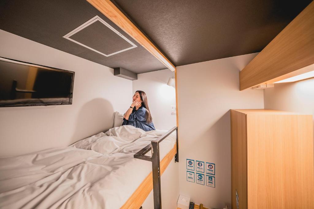 Postel nebo postele na pokoji v ubytování hotel atarayo osaka