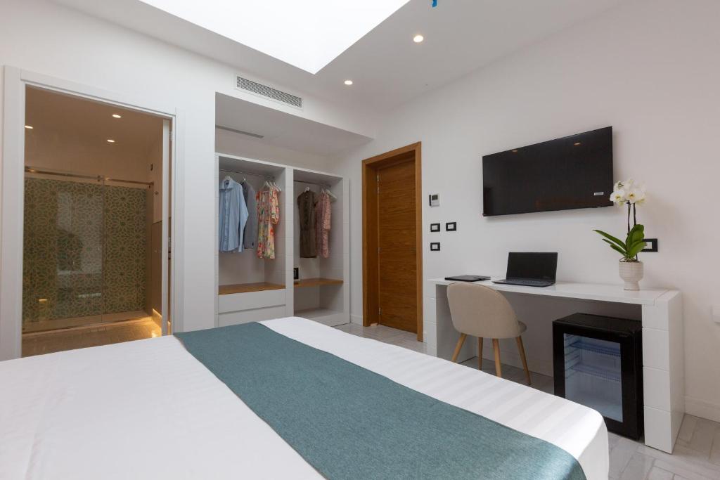 TV a/nebo společenská místnost v ubytování Gioì Hotel Sorrento