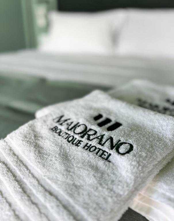 Postel nebo postele na pokoji v ubytování Maiorano Boutique Hotel