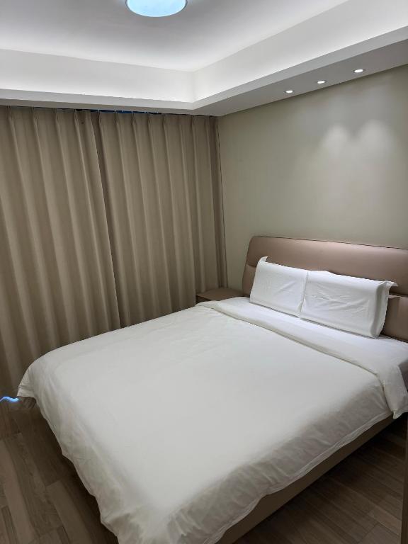 Voodi või voodid majutusasutuse City Center Executive Hotel-Near Manila Airport and PITX toas
