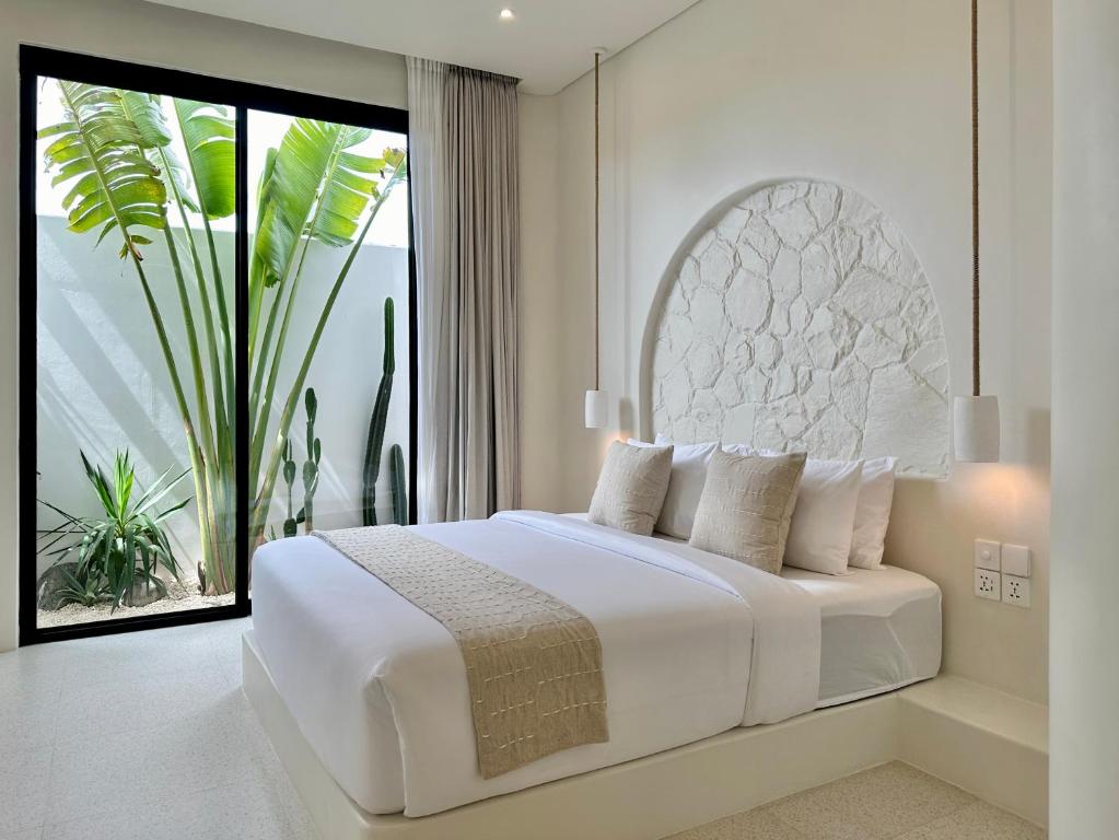 Postel nebo postele na pokoji v ubytování Dolce villas in Bingin