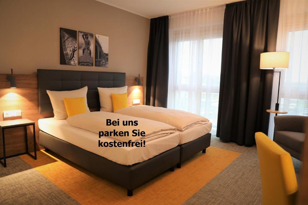Postel nebo postele na pokoji v ubytování Hotel INCLUDiO
