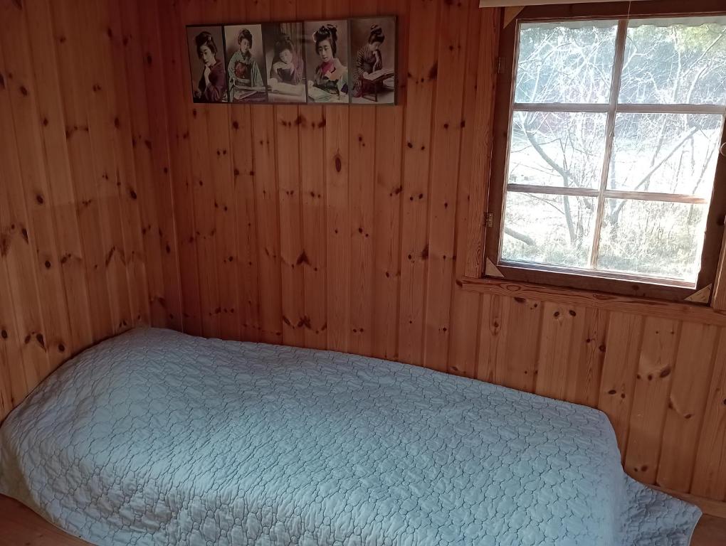 Postel nebo postele na pokoji v ubytování Alva Stugby Gotland