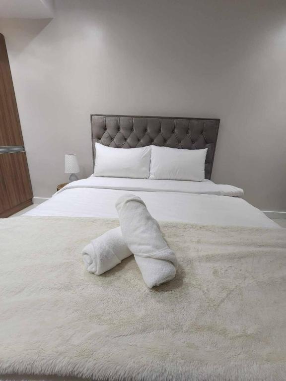 Postel nebo postele na pokoji v ubytování Palms La Union Beachfront Suites