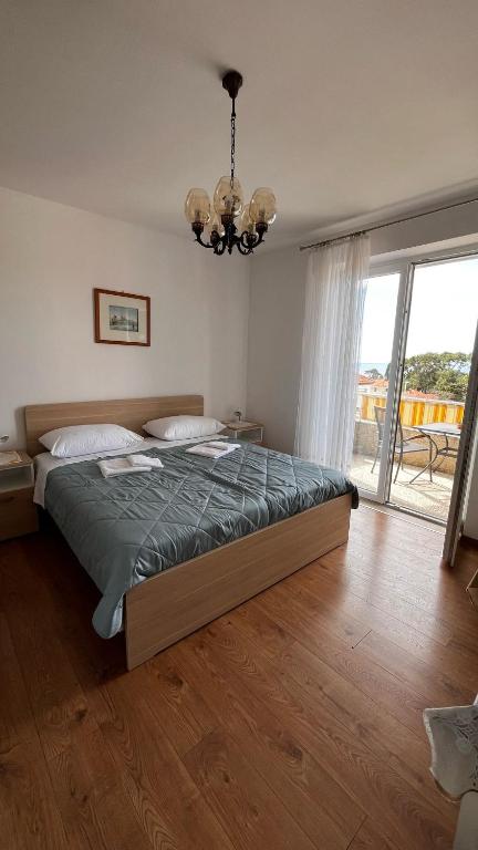 Posteľ alebo postele v izbe v ubytovaní Apartment Zana