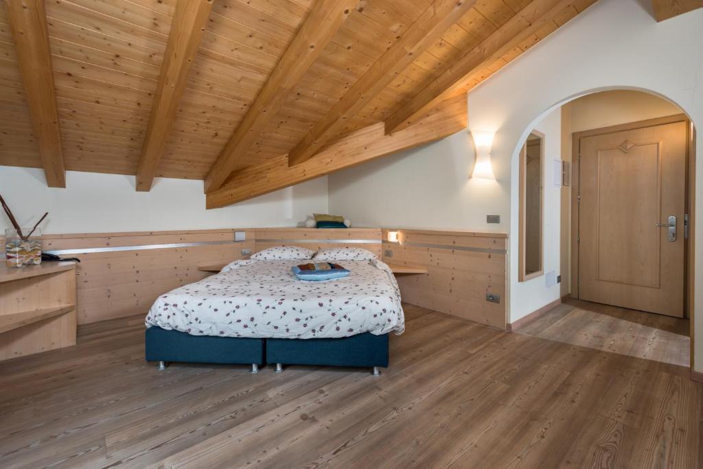 Postel nebo postele na pokoji v ubytování Garnì Val de Grepa