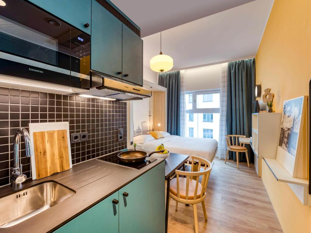 Kuchyň nebo kuchyňský kout v ubytování Aparthotel Adagio Access Kiel