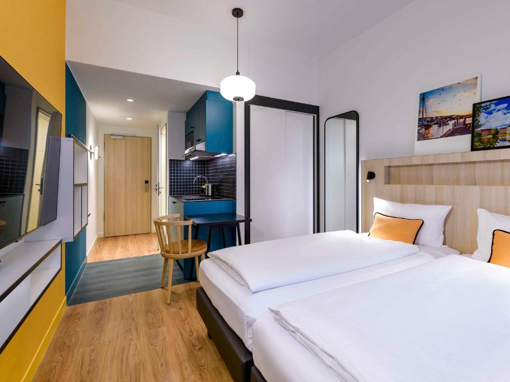 TV a/nebo společenská místnost v ubytování Aparthotel Adagio Access Kiel