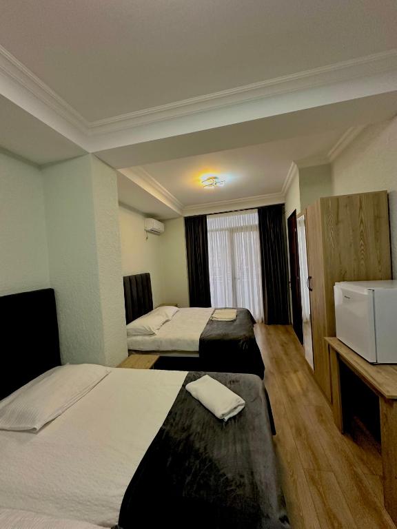 Postel nebo postele na pokoji v ubytování Hotel balcony