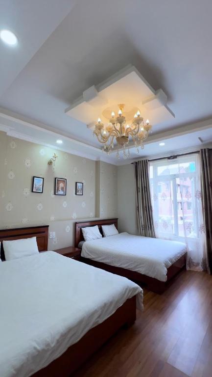 Postel nebo postele na pokoji v ubytování Dang Uyen 1 Hotel