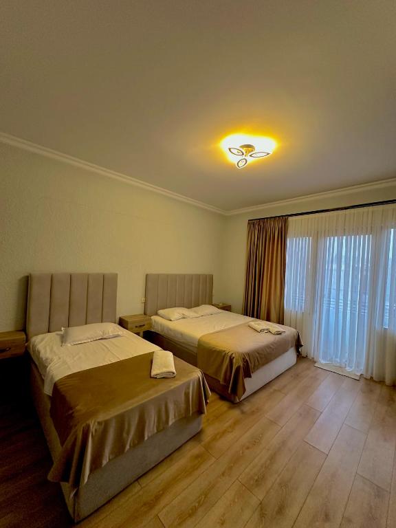 Postel nebo postele na pokoji v ubytování Hotel balcony