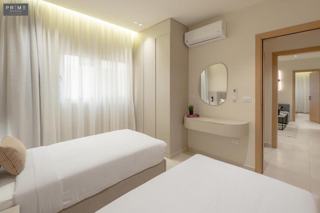 Postel nebo postele na pokoji v ubytování Prime Residence Zayed Heights