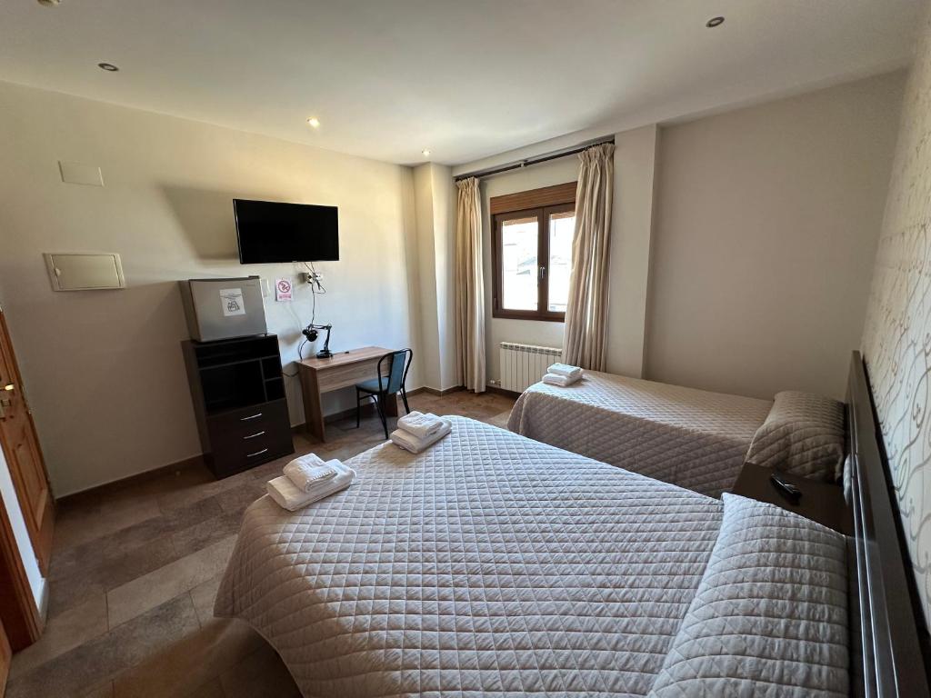 Postel nebo postele na pokoji v ubytování Hostal Venecia