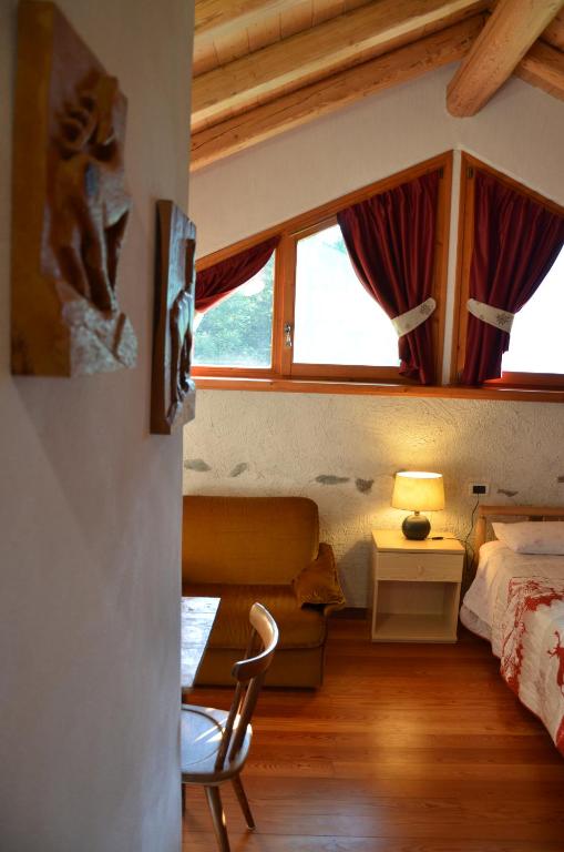 Postel nebo postele na pokoji v ubytování Chalet Maso Salam