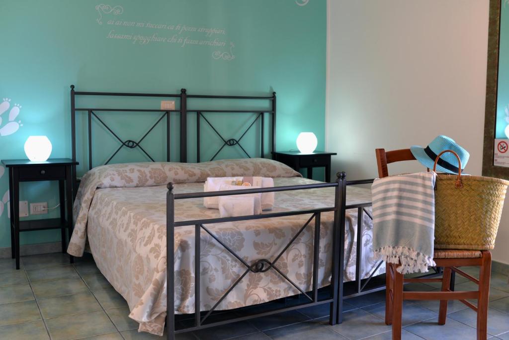 Postel nebo postele na pokoji v ubytování Hotel Donna Rosa
