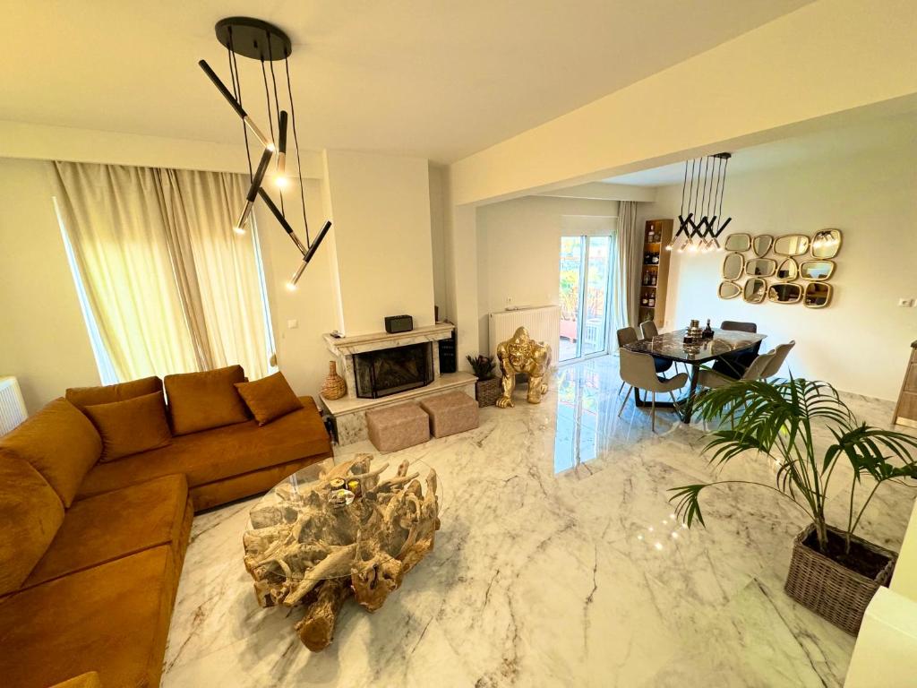 a living room with a couch and a fireplace at Rhodes Villa 365 in Rhodes Town