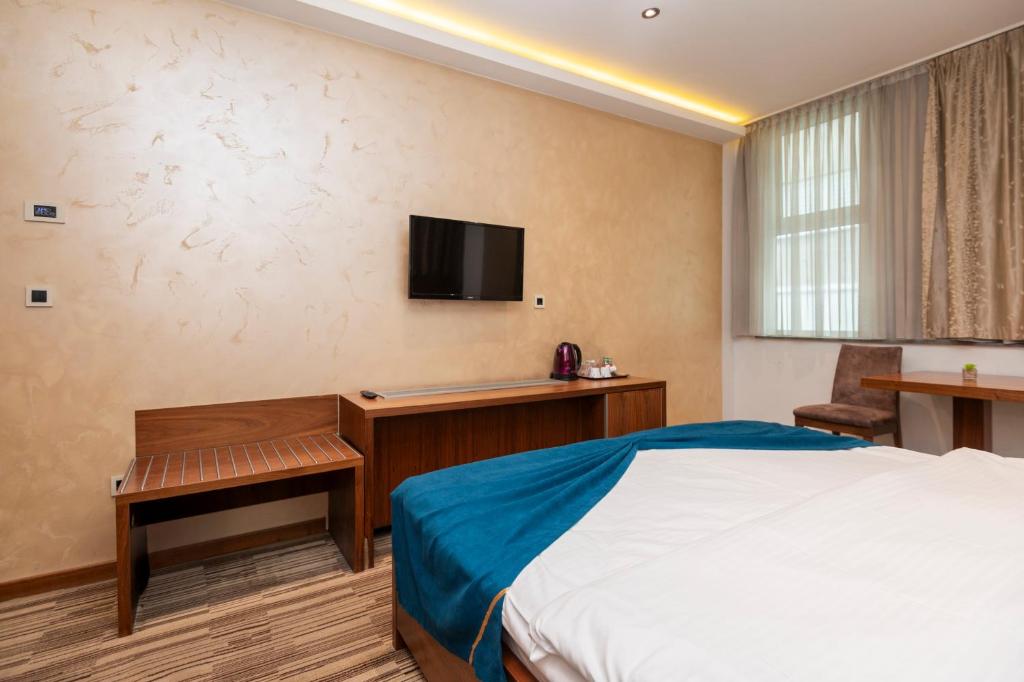 Sjónvarps- og/eða afþreyingartæki á Hotel Bistrik City Center