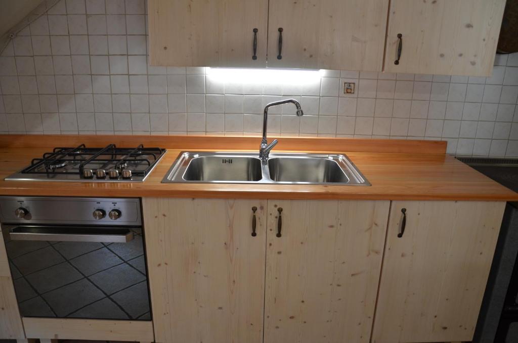 Kuchyň nebo kuchyňský kout v ubytování Chalet Maso Salam