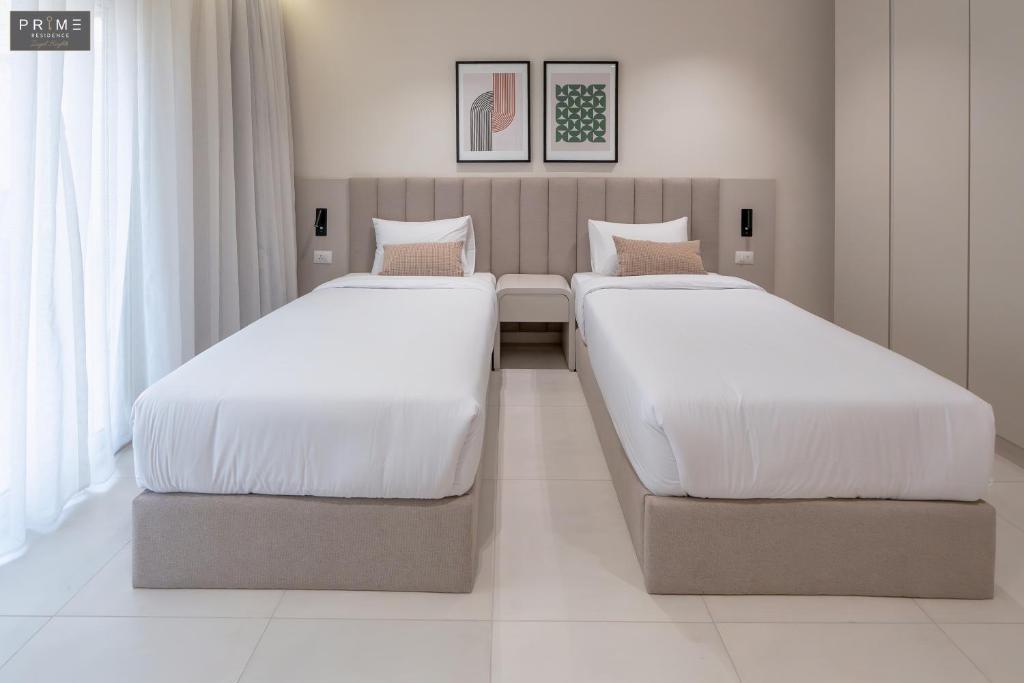 Postel nebo postele na pokoji v ubytování Prime Residence Zayed Heights