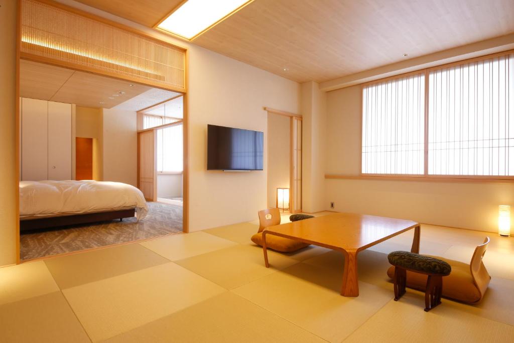 Postel nebo postele na pokoji v ubytování Hotel Honnoji