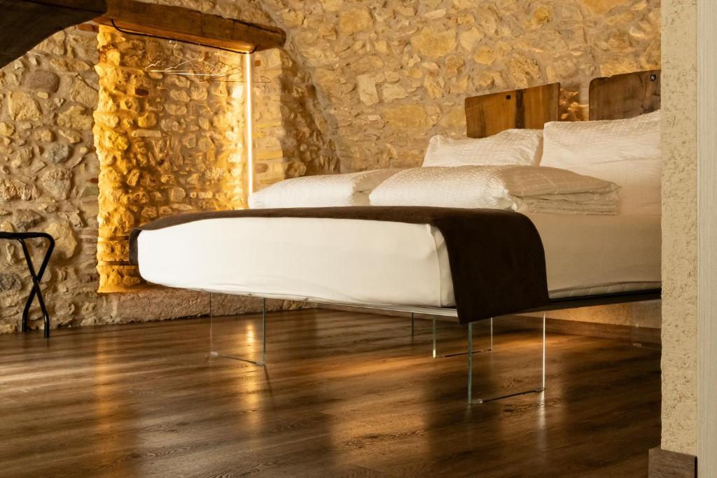 Postel nebo postele na pokoji v ubytování Domus Mea Suites
