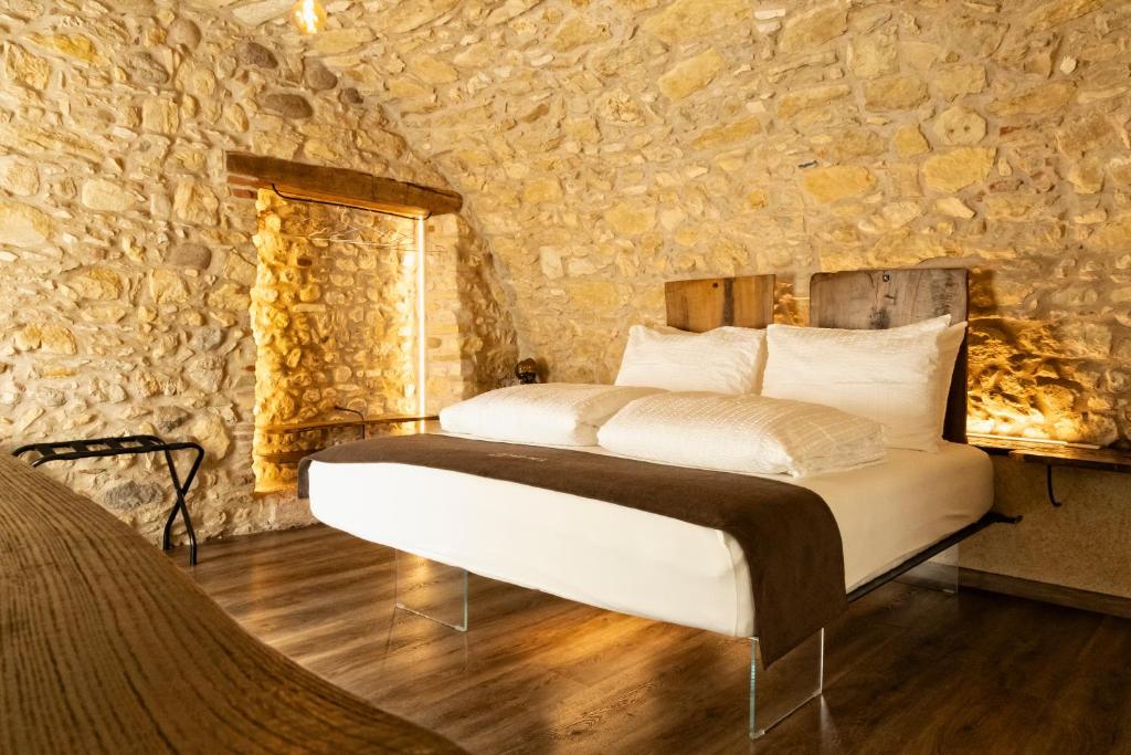 Postel nebo postele na pokoji v ubytování Domus Mea Suites