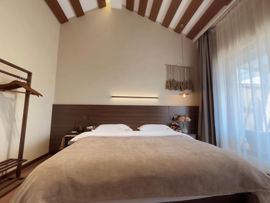 Cama o camas de una habitación en Luyu Shijian B&B