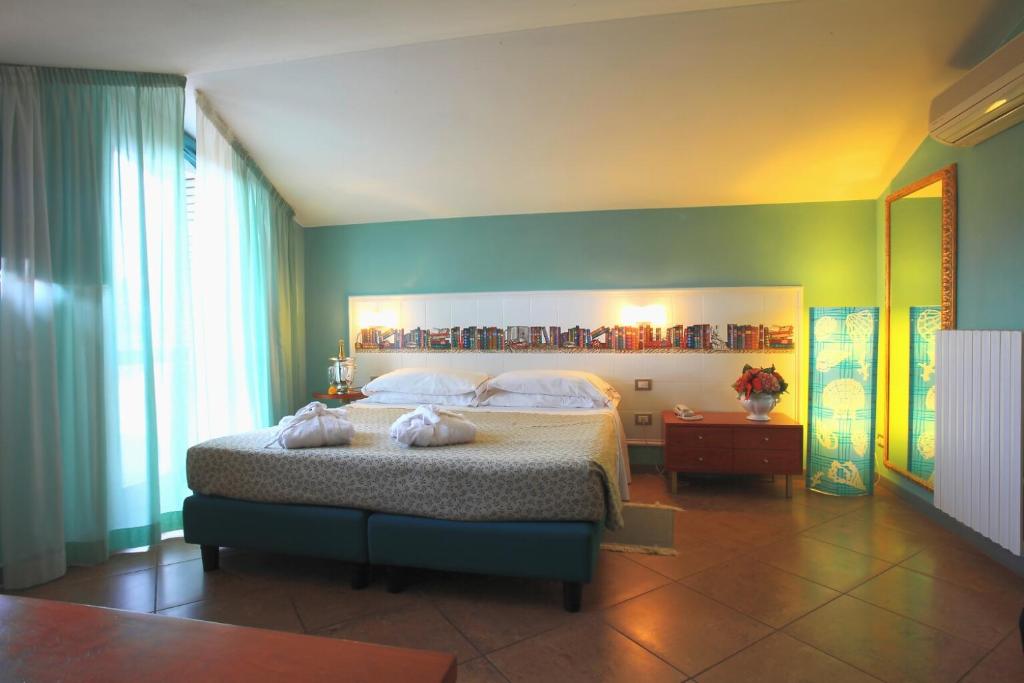 Postel nebo postele na pokoji v ubytování Hotel Alexandra