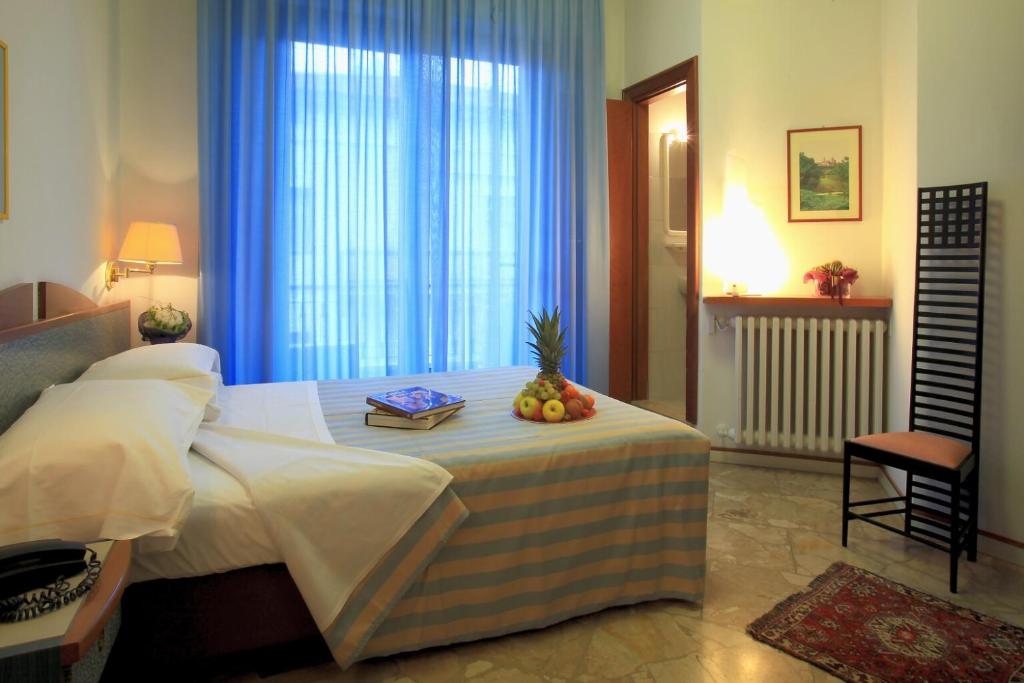 Postel nebo postele na pokoji v ubytování Hotel Alexandra