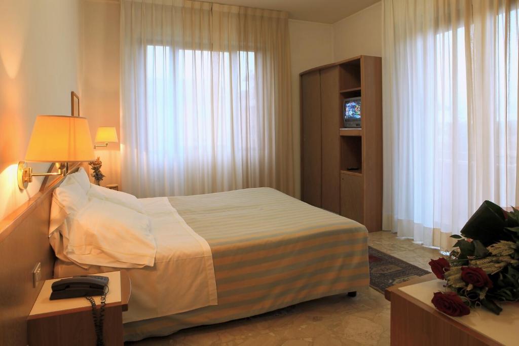 Postel nebo postele na pokoji v ubytování Hotel Alexandra