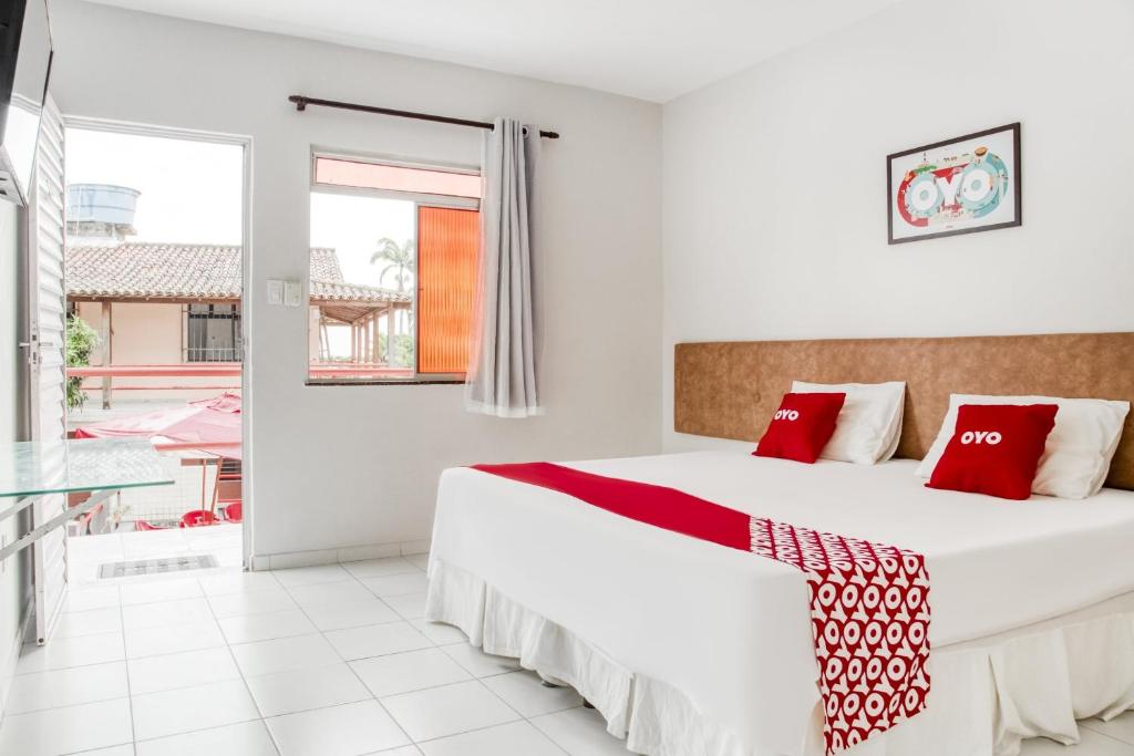 Postel nebo postele na pokoji v ubytování OYO Praia Hotel Recanto do Tomé - Salvador