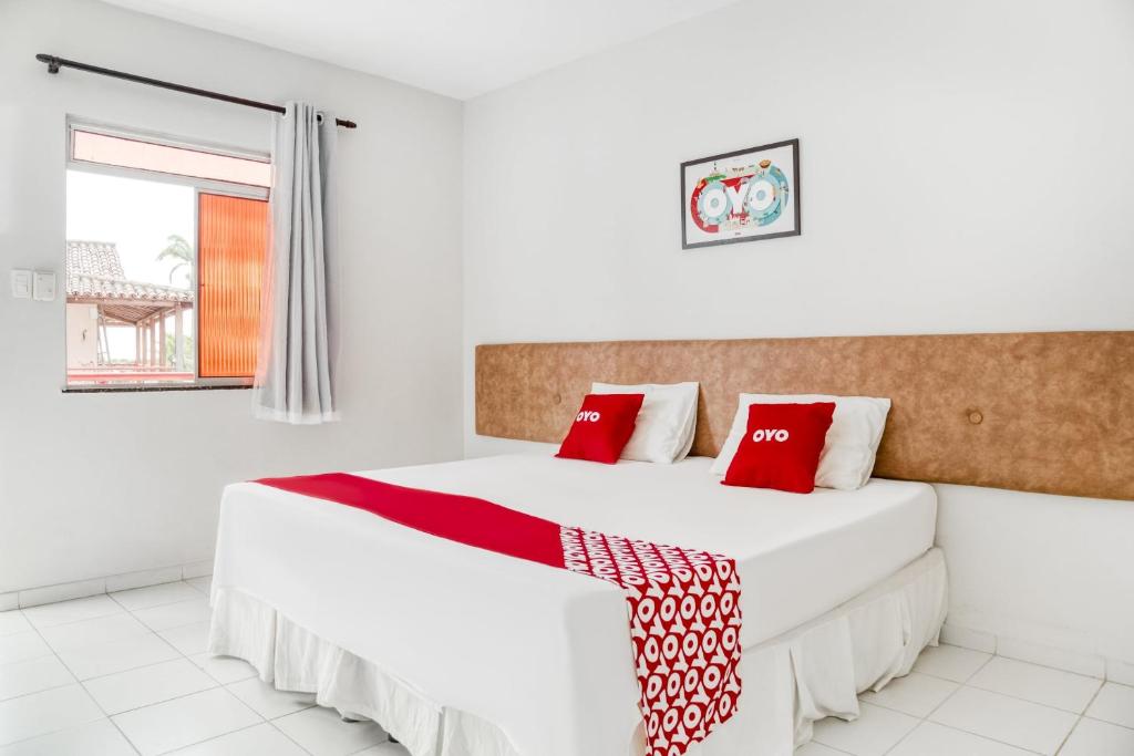 Postel nebo postele na pokoji v ubytování OYO Praia Hotel Recanto do Tomé - Salvador