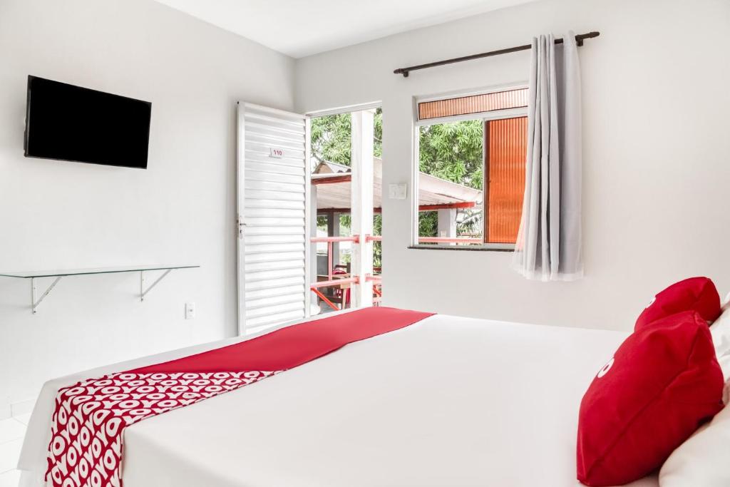 Postel nebo postele na pokoji v ubytování OYO Praia Hotel Recanto do Tomé - Salvador