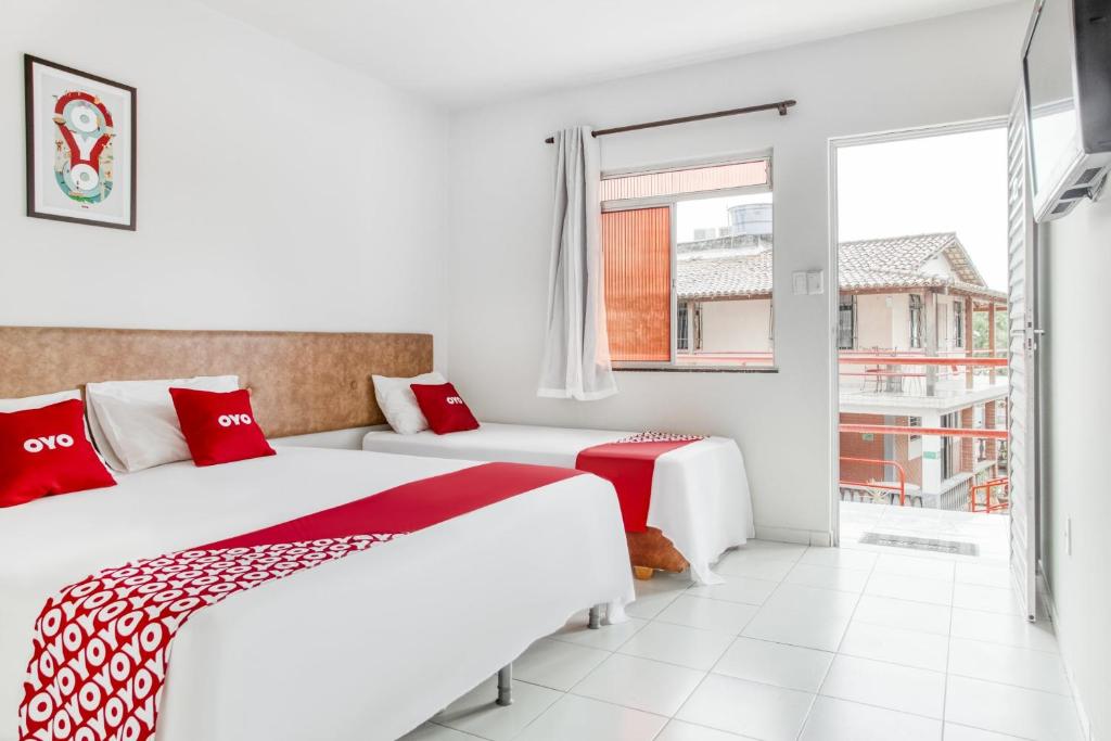 Postel nebo postele na pokoji v ubytování OYO Praia Hotel Recanto do Tomé - Salvador