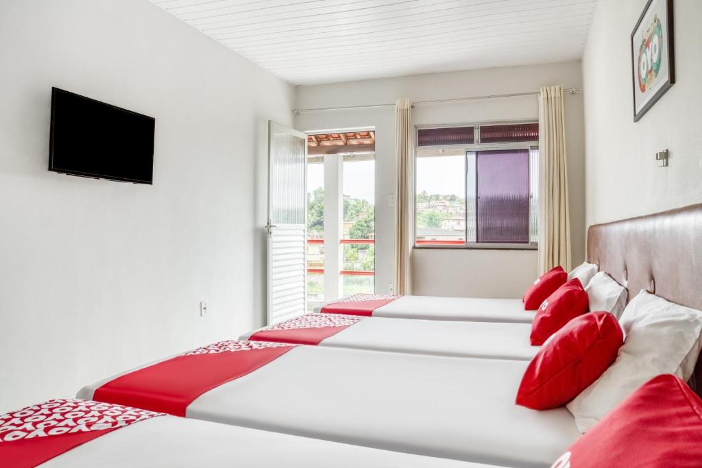 Postel nebo postele na pokoji v ubytování OYO Praia Hotel Recanto do Tomé - Salvador