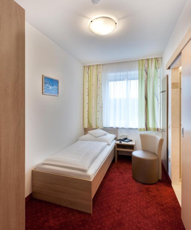 Postel nebo postele na pokoji v ubytování Hotel Restaurant Wallner I contactless check-in