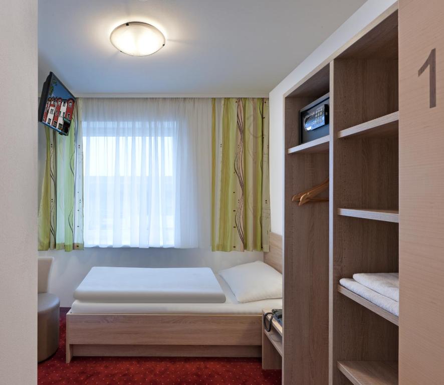 Postel nebo postele na pokoji v ubytování Hotel Restaurant Wallner I contactless check-in