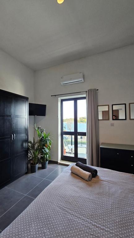 Postel nebo postele na pokoji v ubytování Aime's House