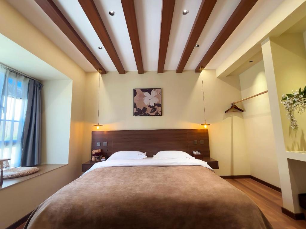Cama o camas de una habitación en Luyu Shijian B&B