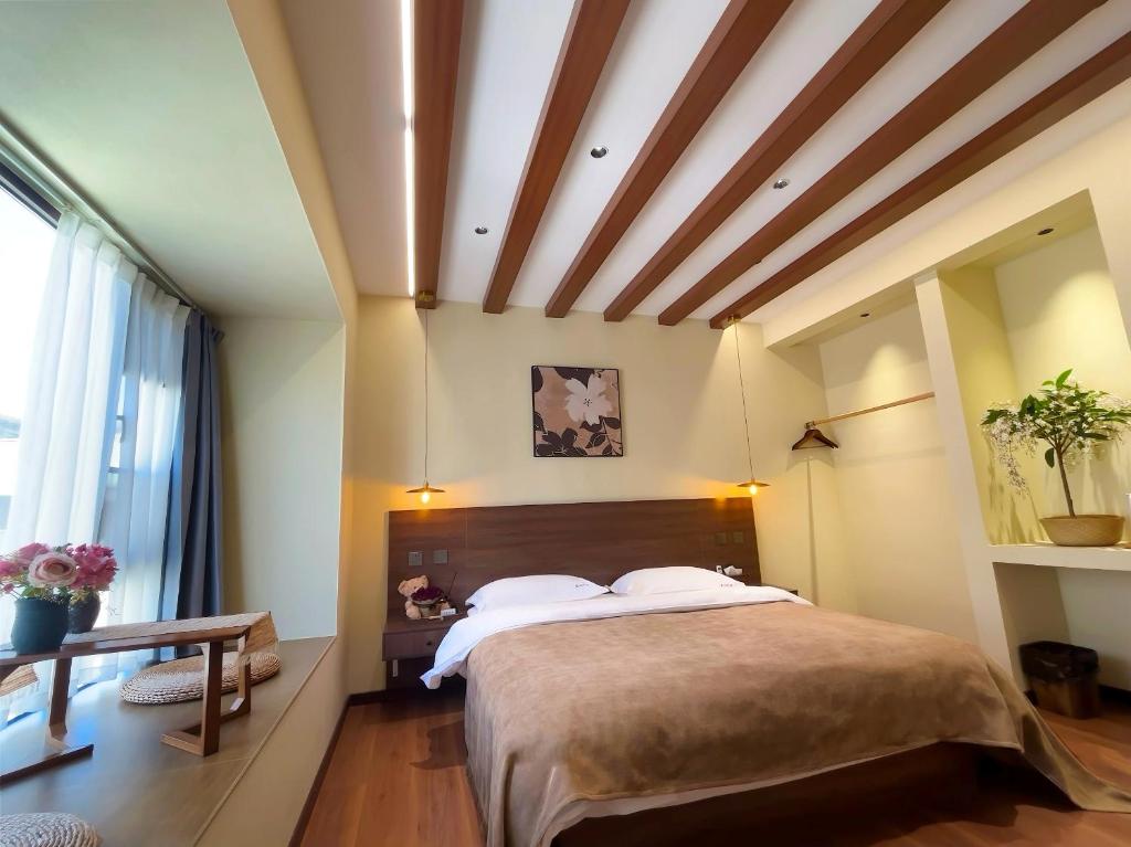 Cama o camas de una habitación en Luyu Shijian B&B