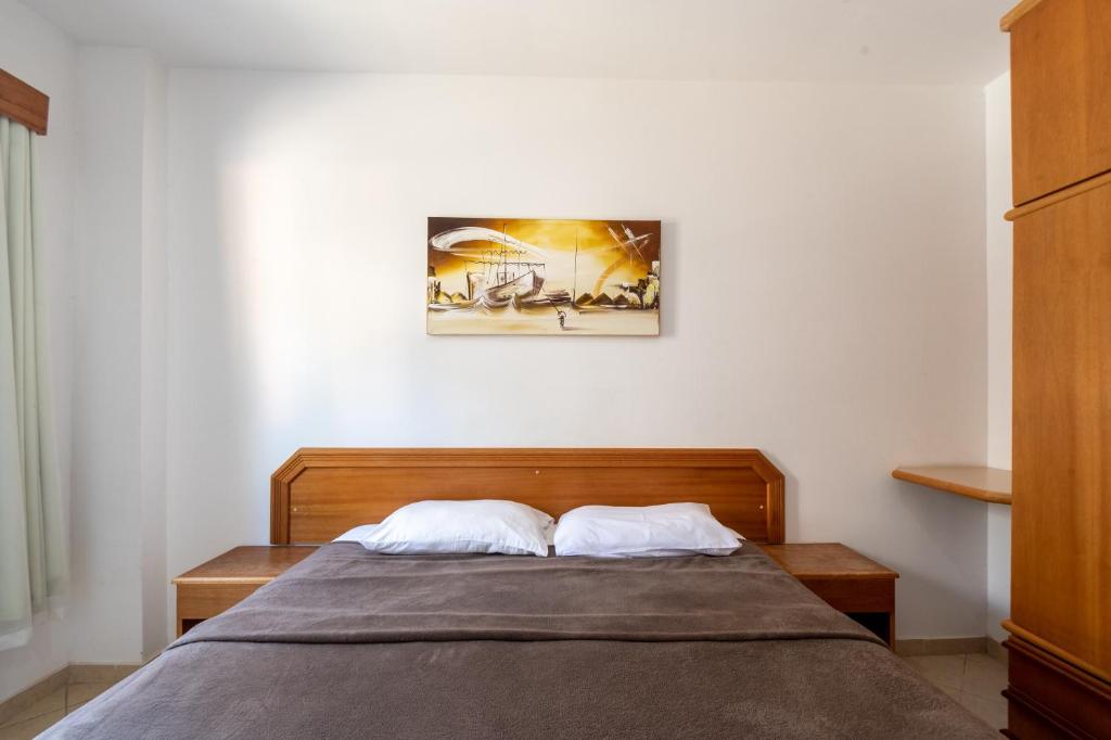 Postel nebo postele na pokoji v ubytování OYO Residencial Itacuruçá Apart Hotel, Mangaratiba