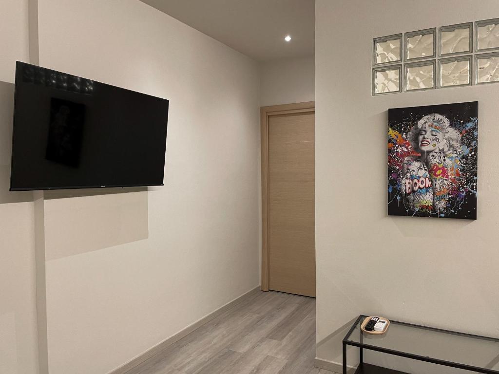 TV a/nebo společenská místnost v ubytování 7Suites