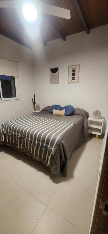 En eller flere senge i et værelse på Ubicación Perfecta