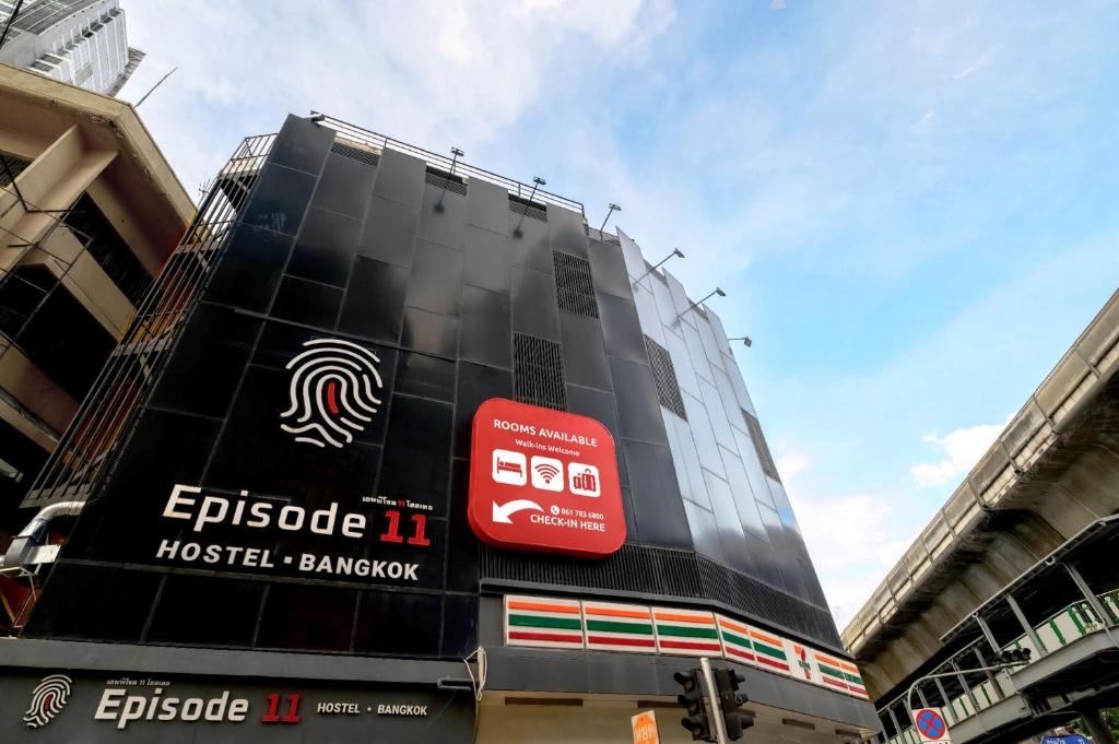 a building with a sign on the side of it at Episode 11 Hostel Sukhumvit in Bangkok